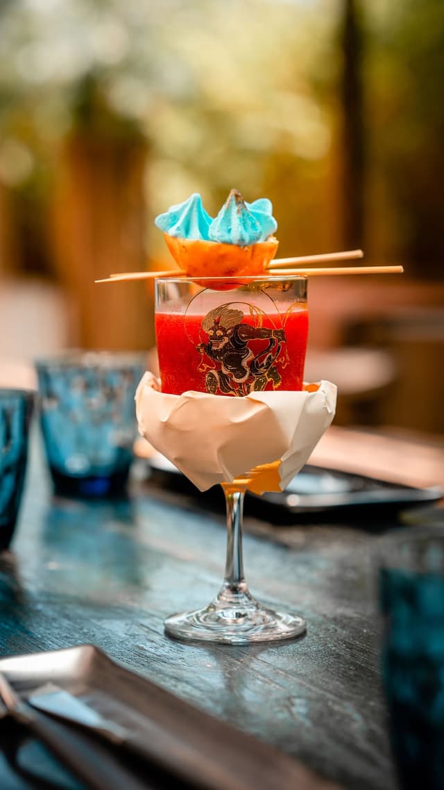 A signature Santoku cocktail, garnished and served tableside.